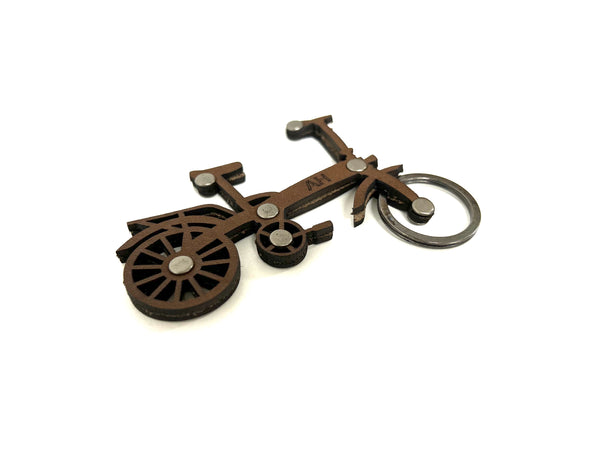 Bicycle-shaped keychain on a white background