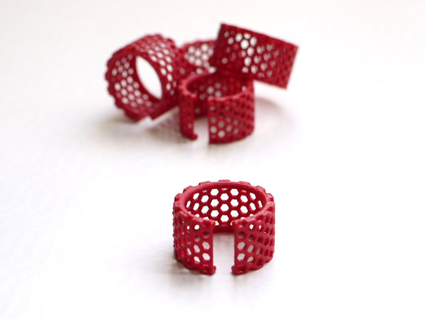 3d printed honeycomb ring in red